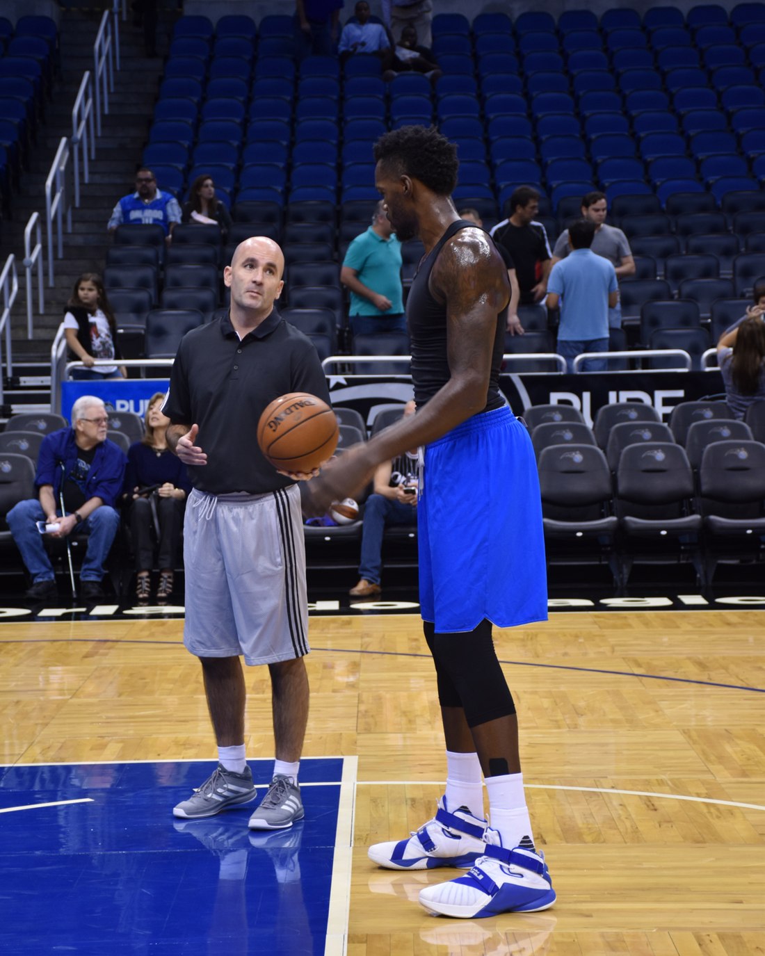 Coach Dave Love working with Dewayne Dedmon on an NBA court